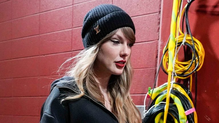 Taylor Swift arrives at Chiefs-Bills AFC Championship in black Louis Vuitton outfit